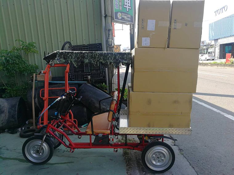 Cargo loaded on electric ligh lorry.